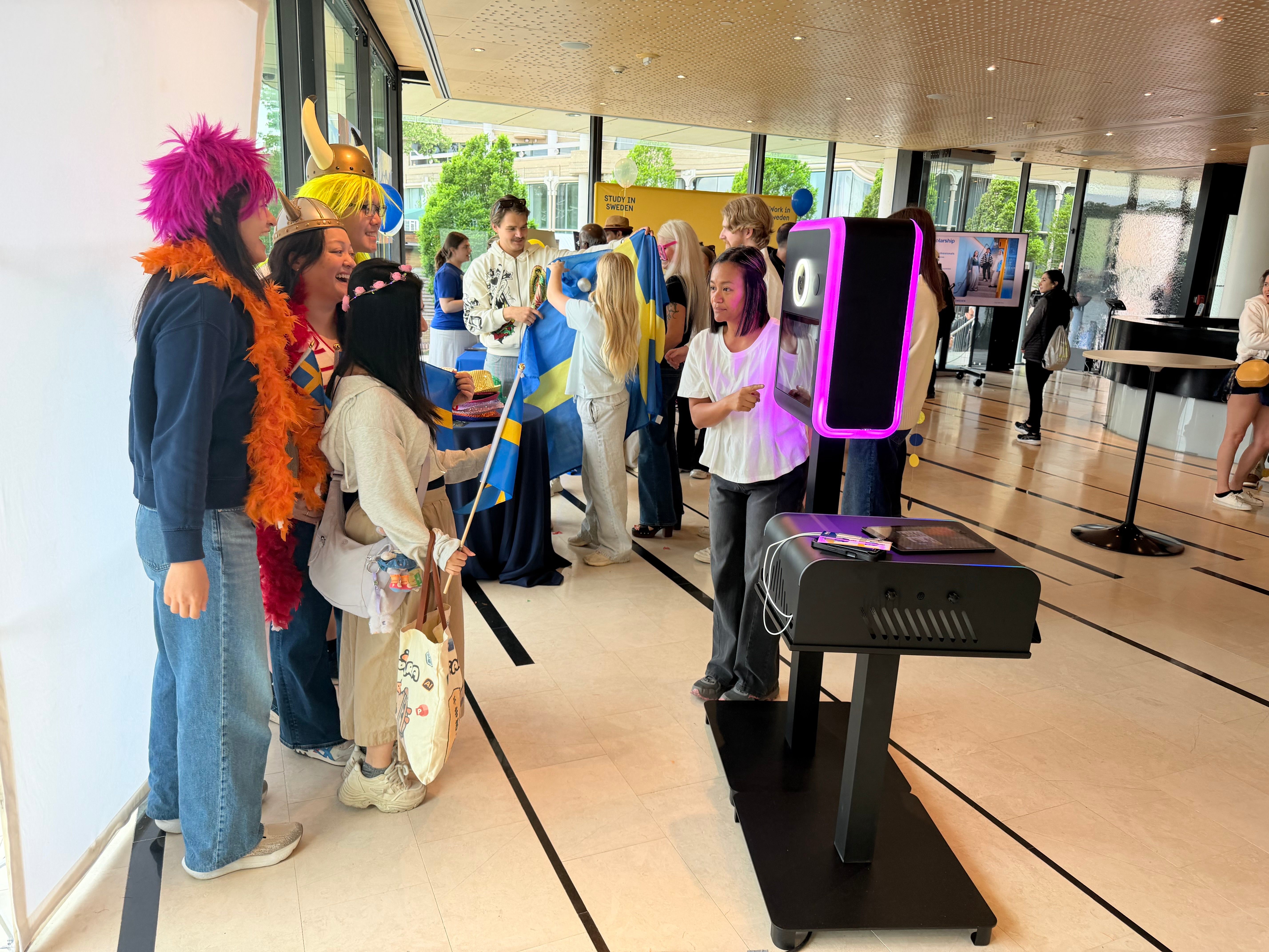 Guests lined up with fun props at The Infinite Booth corporate event