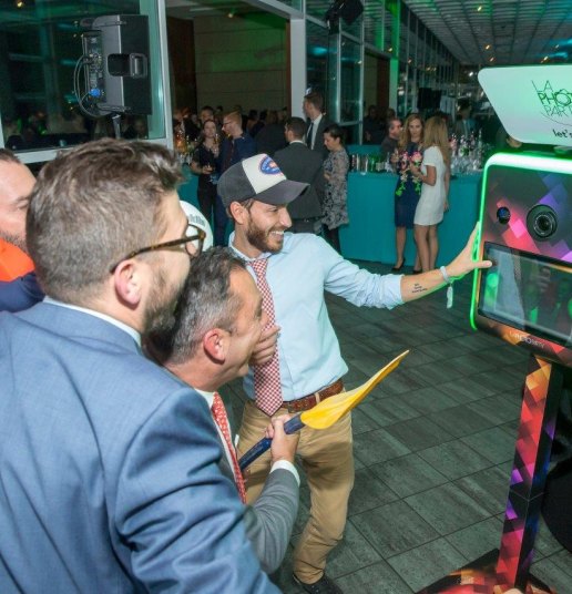 Guests having fun using The Infinite Booth at a corporate event